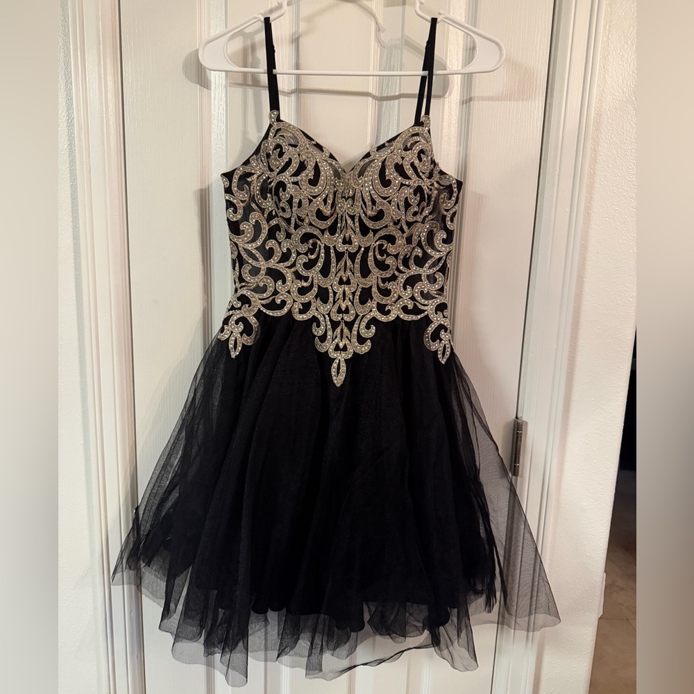 Blondie Nites Black Dress with Silver and Gold Logo Detail